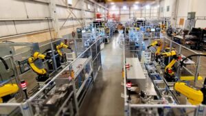Industrial automation production line with collaborative robots, illustrating KUKA embodied-AI and humanoid robot deployment